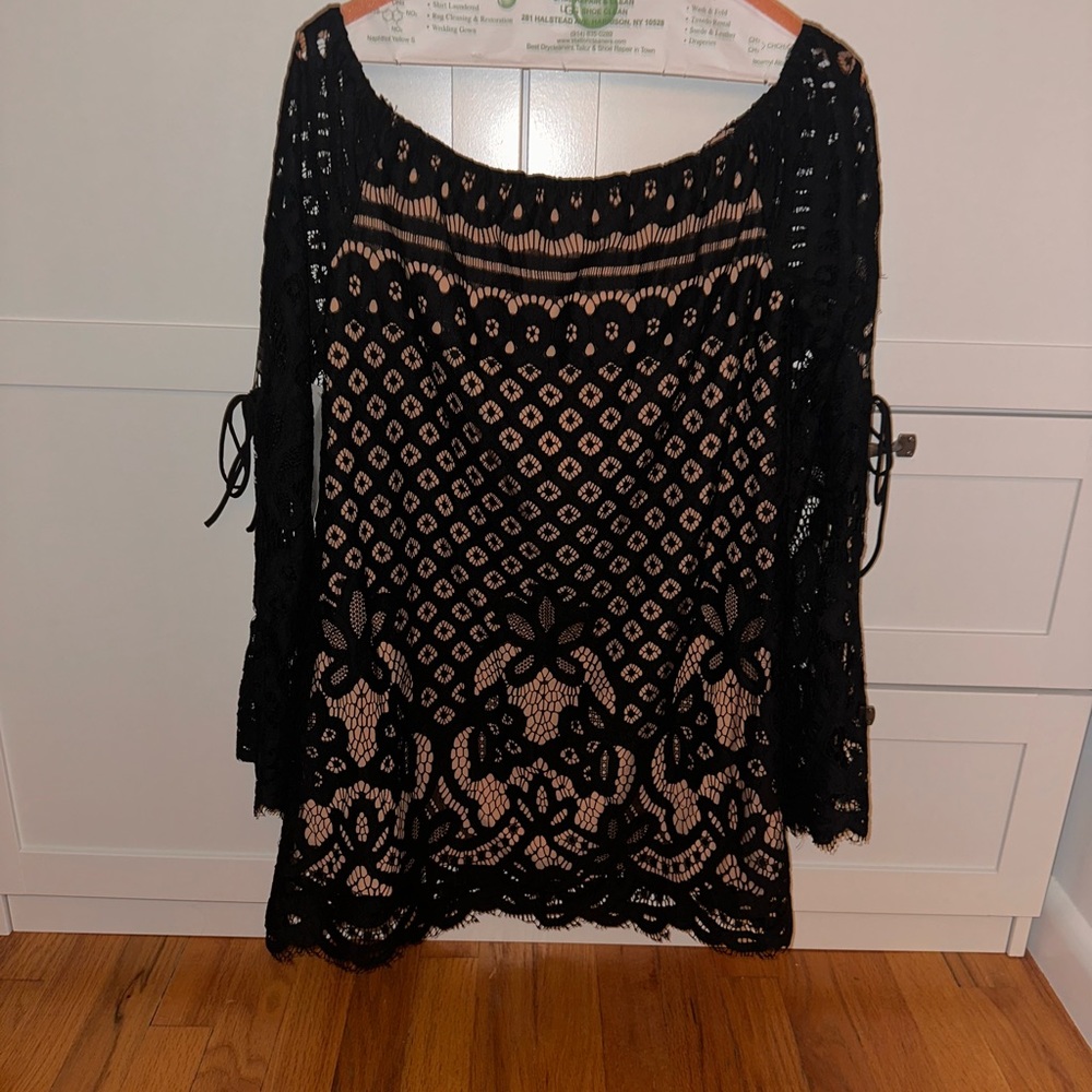 Woman’s off the shoulder black lace dress (slip underneath)